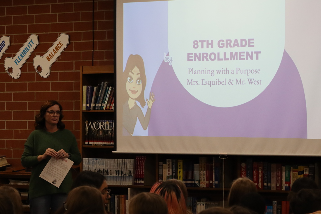 Mrs. Esquibel speaking with 7th grade students.