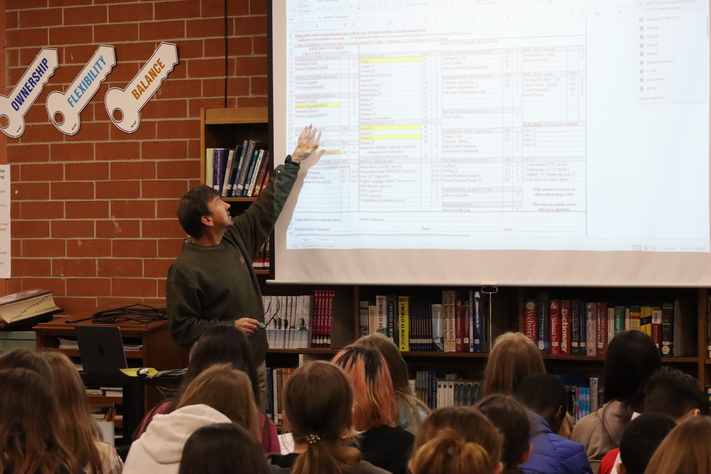 Mr. West speaking with 7th grade students.