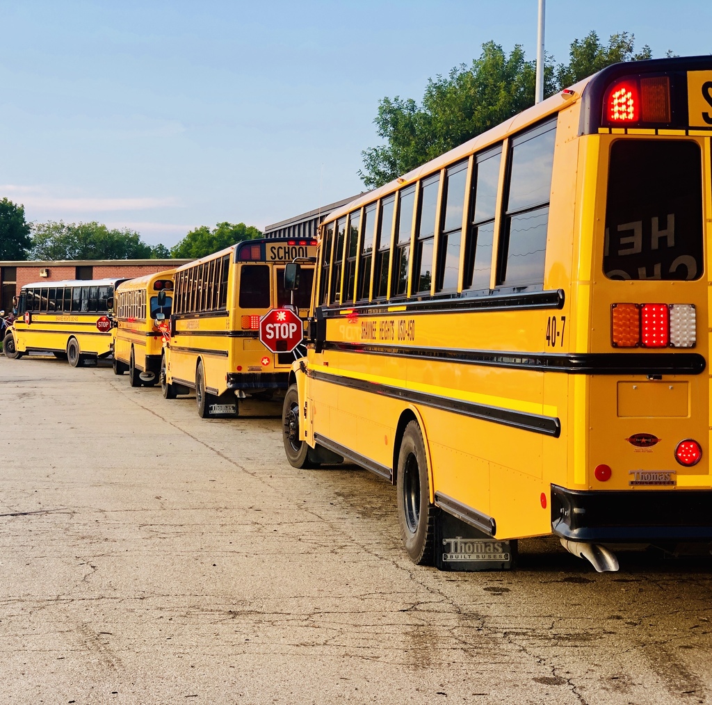 USD 450 busses lined up to disgorge eager middle schoolers.